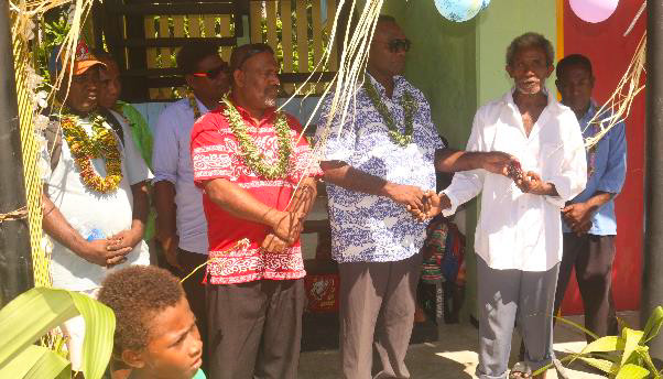 (l-R) Contractor, PS MECCDM, MPA, PS MPGIS, Hon. Premier Central Province, Village Chief, & Rara Head Master during cutting of ribbon and handing over of keys to the classrooms. (l-R) Contractor, PS MECCDM, MPA, PS MPGIS, Hon. Premier Central Province, Village Chief, & Rara Head Master during cutting of ribbon and handing over of keys to the classrooms.
